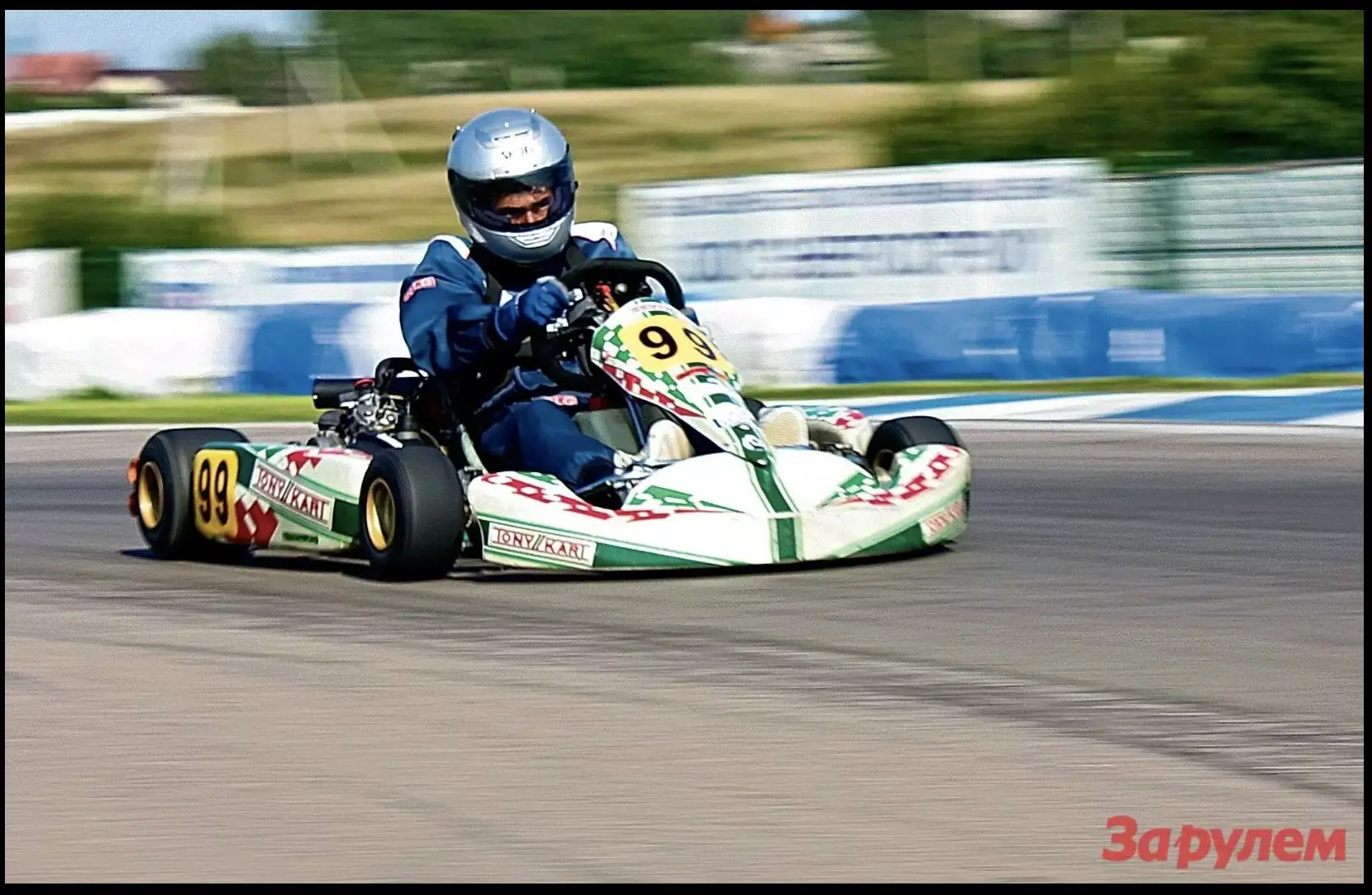 Alan racing a kart on track