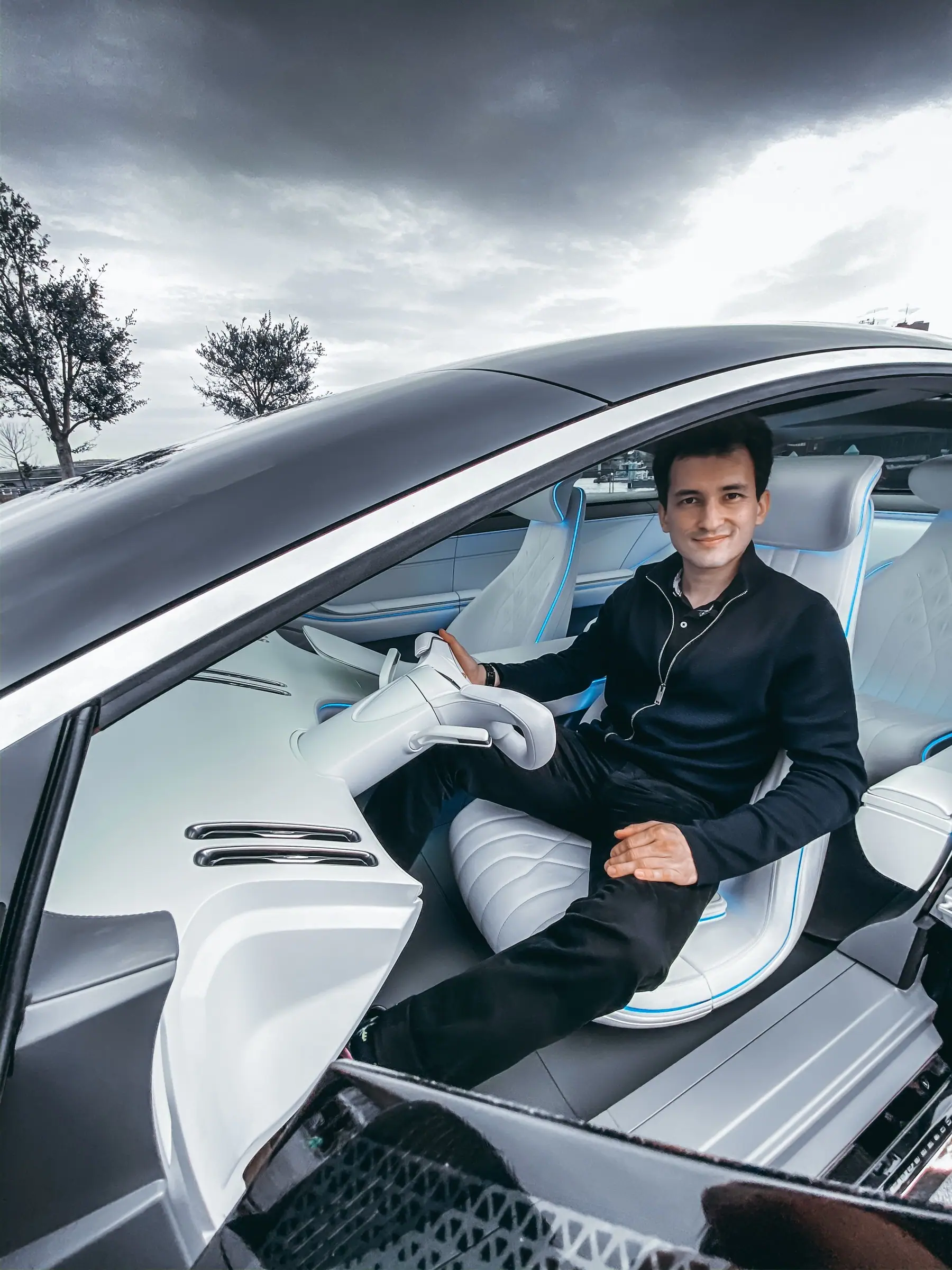 Alan seated in the white lounge interior of the Vision One-Eleven